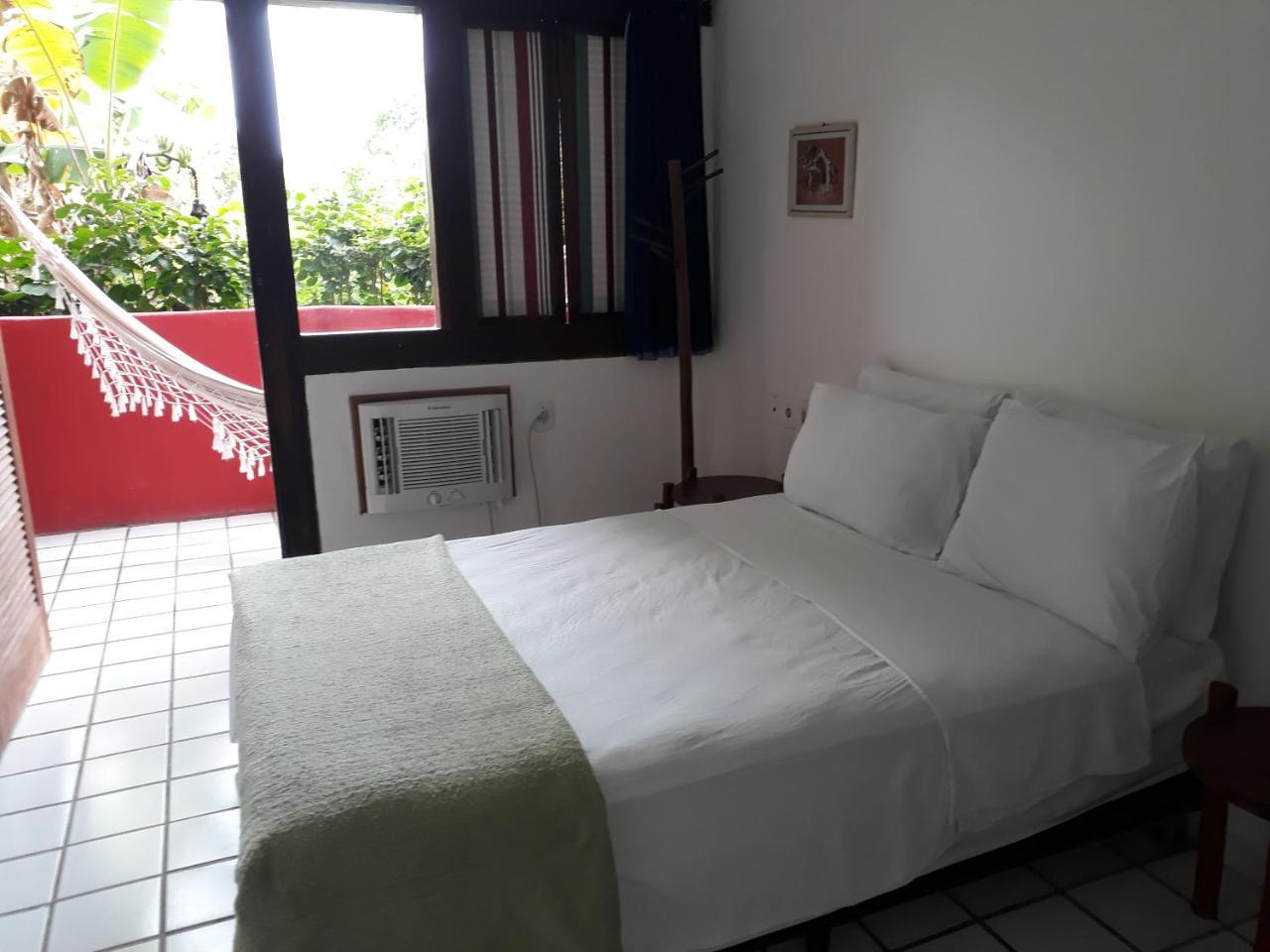 Novos Baianos Hostel E Pousada Порту-Сегуру Экстерьер фото A room at the hotel